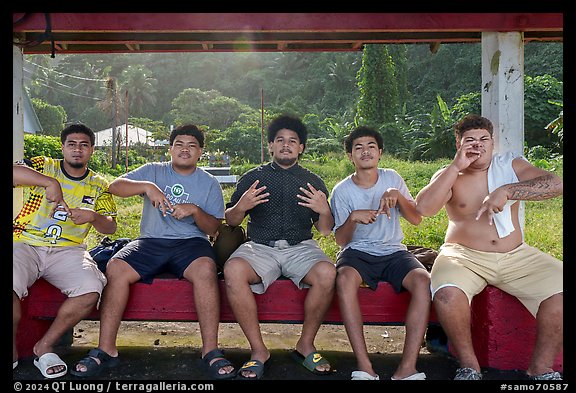 Boys at bus stop, Fagaitua Bay. Tutuila, American Samoa (color)