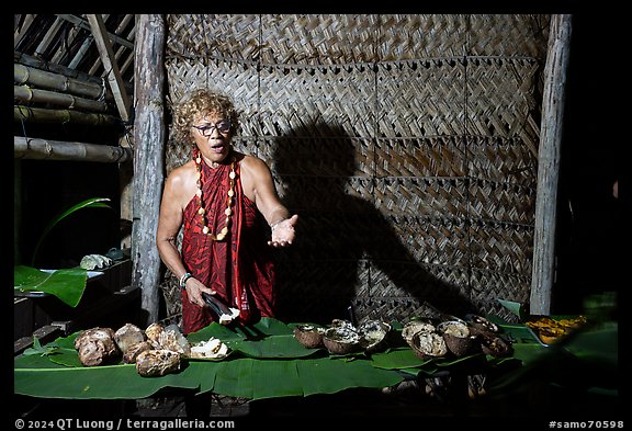 Tisa Faamuli serving Samoan Umu Feast. Tutuila, American Samoa (color)