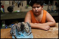 George looking at frozen coconut crab, Ofu Island. American Samoa ( color)