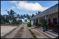Store and beachfront, Olosega. American Samoa ( color)