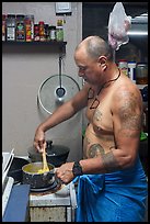 Manaia cooking, Tau Island. American Samoa ( color)