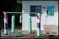 Scuba tanks used as curfew bells, Fagamalo. Tutuila, American Samoa ( color)