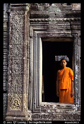 Buddhist monk in doorway, the Bayon. Angkor, Cambodia