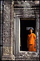 Buddhist monk in doorway, the Bayon. Angkor, Cambodia (color)