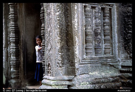 Girl hides in Ta Prom. Angkor, Cambodia