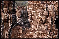 Large stone smiling faces on upper terrace, the Bayon. Angkor, Cambodia (color)