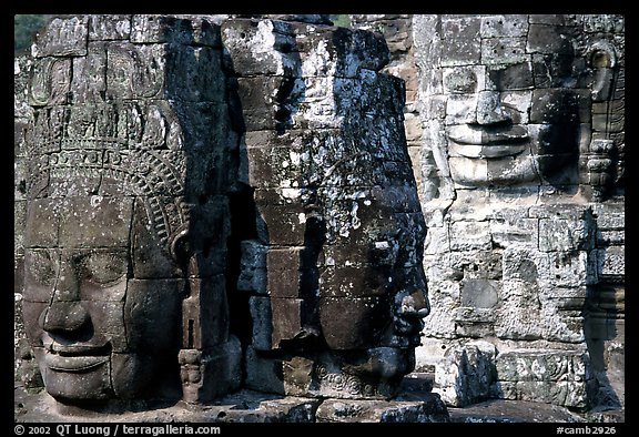 Large stone faces occupying towers, the Bayon. Angkor, Cambodia