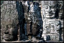 Large stone faces occupying towers, the Bayon. Angkor, Cambodia (color)
