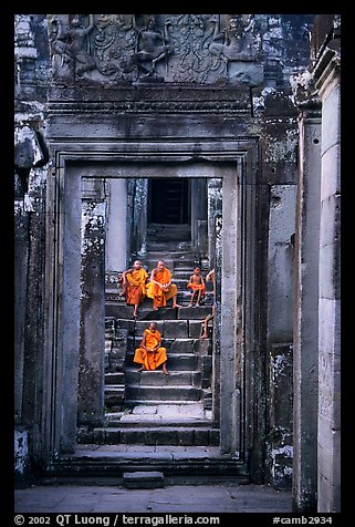 Buddhist monks in the Bayon. Angkor, Cambodia