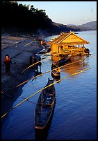 Boats and stilt house of a small hamlet. Mekong river, Laos (color)