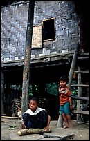 Children near stilt house of a small hamlet. Mekong river, Laos (color)