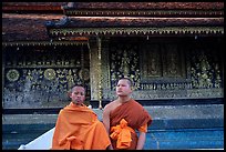 Two buddhist novice monks at Wat Xieng Thong. Luang Prabang, Laos