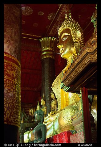 Buddha statues on altar, Wat Xieng Thong. Luang Prabang, Laos (color)