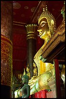 Buddha statues on altar, Wat Xieng Thong. Luang Prabang, Laos