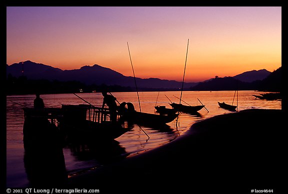 Boats, sunset on the Mekong river. Luang Prabang, Laos