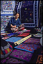 Young woman sells crafts on market. Luang Prabang, Laos (color)