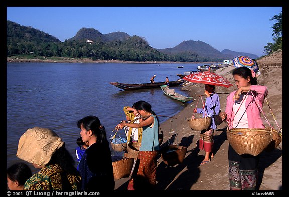 Women on the banks of the Mekong river. Luang Prabang, Laos