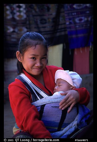 Girl and baby, Ban Xang Hai. Laos