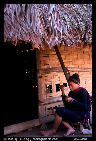 Woman of the Lao Huay tribe in front of her hut,  Ban Nam Sang village. Laos (color)