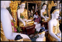 Surrounded by Buddha statues, Shwedagon Paya. Yangon, Myanmar ( color)