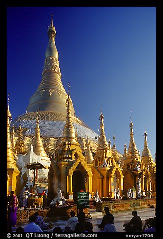 Praying at Planetery post, the Shwedagon Paya. Yangon, Myanmar (color)