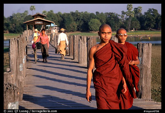 On the two century old U Bein bridge, Amarapura. Mandalay, Myanmar (color)