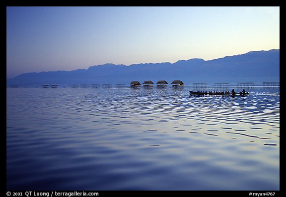 Long boat,  stilts huts, and mountains, sunrise. Inle Lake, Myanmar (color)