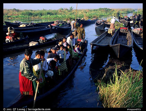 Children commuting to school on small boat. Inle Lake, Myanmar