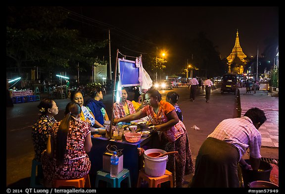 Streat food served at night, Shwedagon Pagoda in background. Yangon, Myanmar