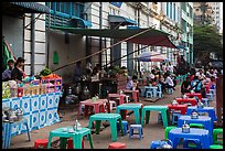 Outdoor eatery sitting on street. Yangon, Myanmar ( color)