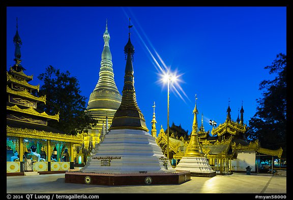Shrines, stupas, and Main Stupa at dawn, Shwedagon Pagoda. Yangon, Myanmar