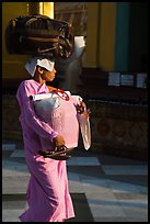 Nun carrying lots of luggage, Shwedagon Pagoda. Yangon, Myanmar ( color)