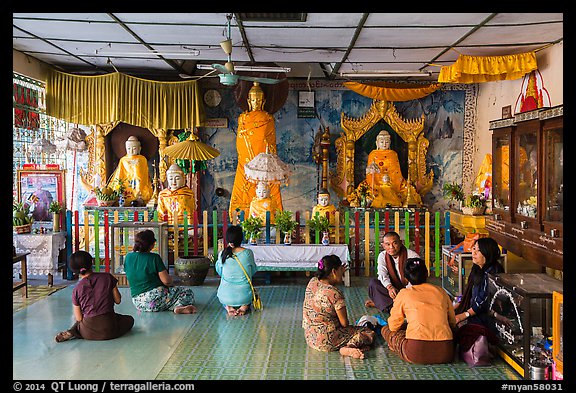 Visitors and altar, Botataung Pagoda. Yangon, Myanmar (color)