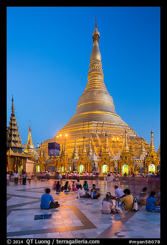 Praying from the Victory Ground, Shwedagon Pagoda, dusk. Yangon, Myanmar (color)