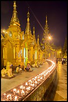 Oil lamps, stupas and shrines at night, Shwedagon Pagoda. Yangon, Myanmar ( color)