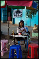 Phone booth operator. Yangon, Myanmar ( color)