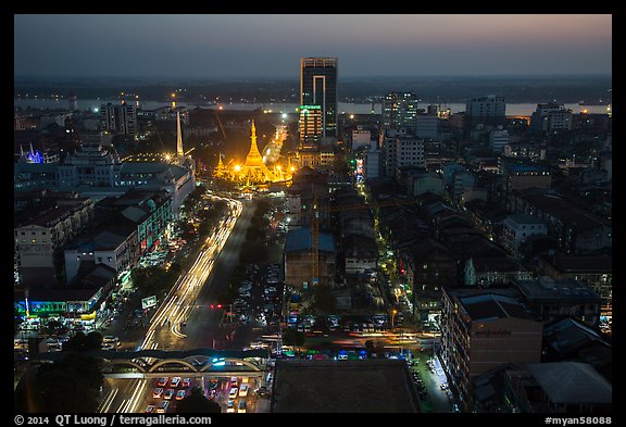 Elevated view of city center at dusk with Sule Pagoda and Yangon River. Yangon, Myanmar