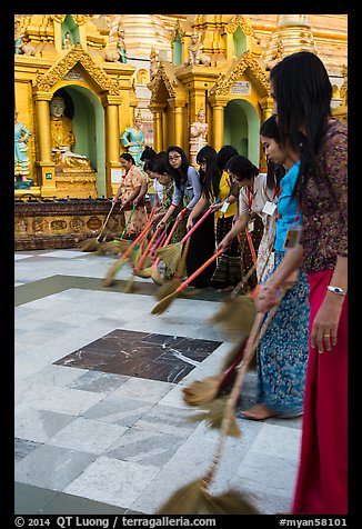 Women sweeping platform, Shwedagon Pagoda. Yangon, Myanmar