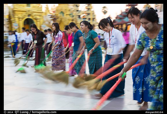 Row of women sweeping, Shwedagon Pagoda. Yangon, Myanmar