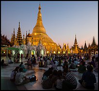 Praying from the Victory Ground, Shwedagon Pagoda, sunset. Yangon, Myanmar ( color)