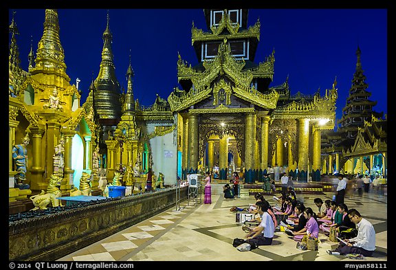 Praying on the platform at night. Yangon, Myanmar (color)