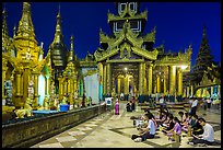 Praying on the platform at night. Yangon, Myanmar ( color)