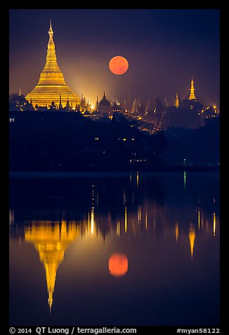 Full Moon setting over Shwedagon Pagoda and Kandawgyi Lake. Yangon, Myanmar (color)