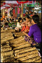 Women selling wood ground to make thanaka. Bagan, Myanmar ( color)