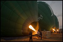 Crew inflates hot air balloons with propane burners. Bagan, Myanmar ( color)
