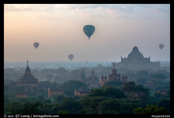 Aerial view of ancient temples and hot air ballons at sunrise. Bagan, Myanmar (color)