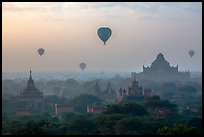 Aerial view of ancient temples and hot air ballons at sunrise. Bagan, Myanmar ( color)