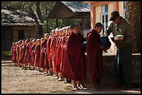 Buddhist novices lining up to receive rice for lunch, Nyaung U. Bagan, Myanmar ( color)