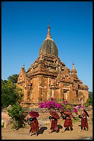 Four novices walk next to temple. Bagan, Myanmar ( color)