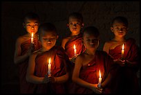 Young buddhist novices holding candles. Bagan, Myanmar ( color)